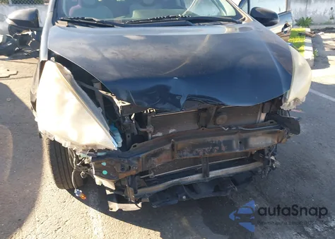 2014 Toyota Prius C One from USA, damaged, VIN JTDKDTB32E1557743